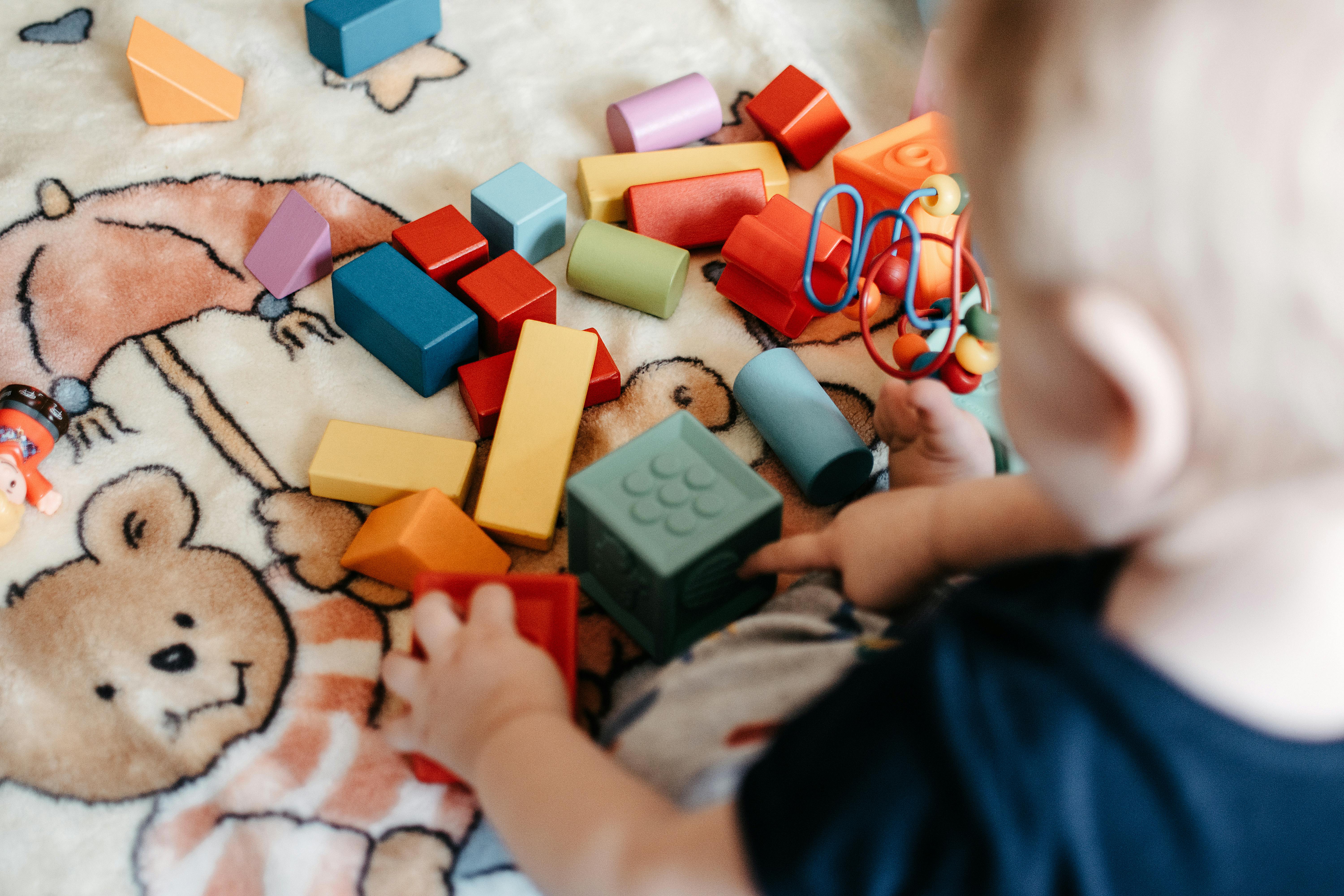 Child building with blocks to support coordination